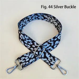 Close-up of leopard pattern fabric strap with silver rotating metal buckles