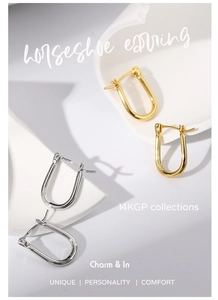 Detail view of U-shaped horseshoe earrings in gold and silver finish 14KGP brass