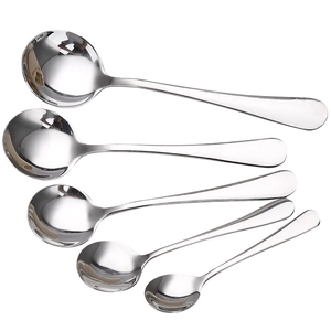Set of 5 polished silver stainless steel round soup spoons in varying sizes on white