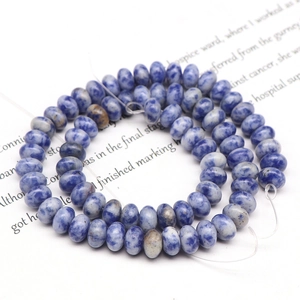 Macro shot of blue and white marble textured natural stone beads for DIY jewelry making