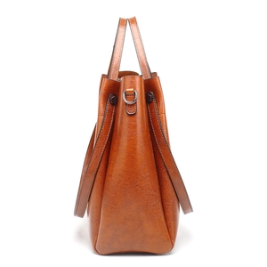 Vintage brown oil wax leather bucket bag with silver D-ring hardware and top handles