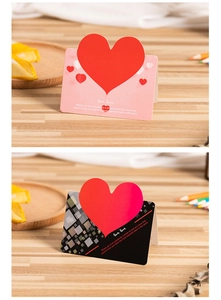 Detail of pink and black 3D pop-up heart greeting cards with romantic English text