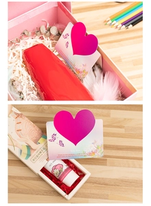 Detail shot of a 60ml moisturizing hand cream tube with elegant gift box and heart card