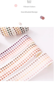Macro detail of gradient polka dot washi tape rolls for scrapbooking and DIY journals