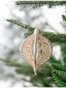 Detail of champagne gold glitter onion ornament with hollow lace on Christmas tree