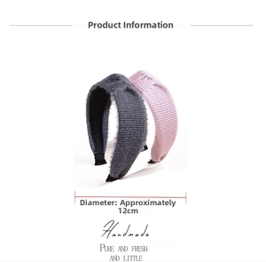 Detail view of handmade knitted mohair headbands in grey and pink with 12cm diameter