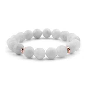 Macro detail of natural white marble beads bracelet with rose gold plated spacers