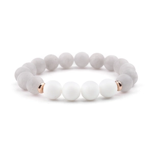 Detail view of natural white turquoise beads and matte white stones on elastic bracelet