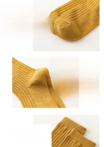Detailed views of ginger yellow ribbed cotton socks showing elastic toe and breathable cuff