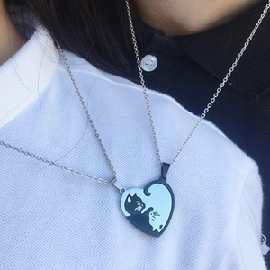 Matching cat couple necklaces with heart puzzle pendants in black and white finish