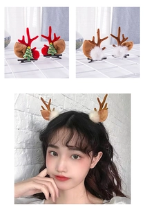 Detail of Christmas reindeer antler hair clips with tree and white pompom decorations