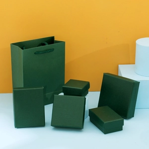 Dark green jewelry gift box set with paper bag and boxes for rings and necklaces