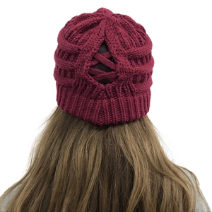 Detail showing back cross-opening design on burgundy knit hat for ponytail users