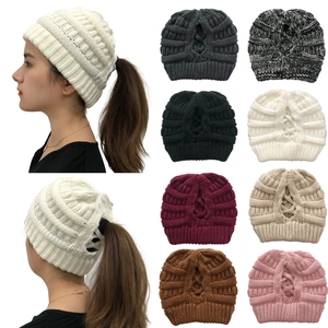 Detail view of knitted ponytail beanie in various colors with back opening for hair