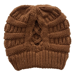 Close-up of deep brown chunky knit beanie with stylish cross weave texture detail