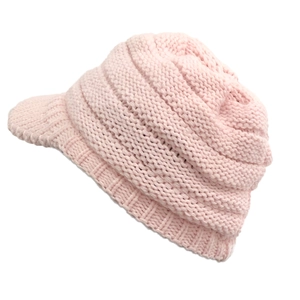 Detail view of pink knit winter hat featuring wavy knit pattern and short visor brim