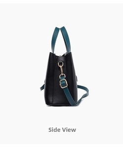 Vista laterale della borsa tote in pelle nera con manici a contrasto blu pavone