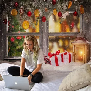 Cozy Christmas backdrop with snowy window pine branches and lanterns for photography