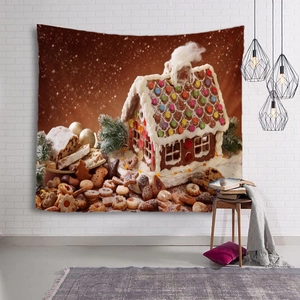Tapisserie de Noël avec maison en pain d'épices accrochée sur un mur de briques blanches
