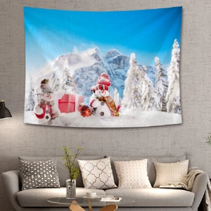 Christmas wall tapestry featuring cute snowmen and snowy mountains in a cozy living room