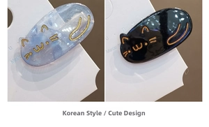 Detailed view of cute cat hair clips in sparkling blue marble and solid black resin finish