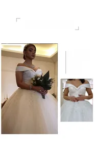 Détail d'une robe de mariée à épaules dénudées avec dentelle délicate et de paillettes