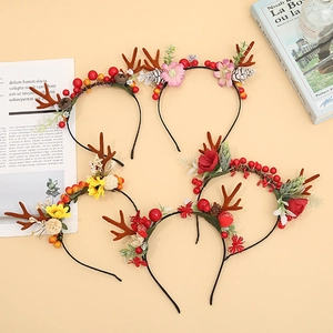 Five styles of Christmas reindeer antler headbands with red berries and pine cones