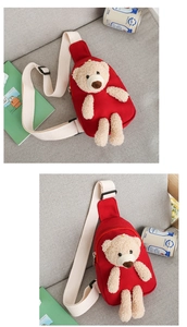 Detail of red canvas kids chest bag with plush bear decor and adjustable strap