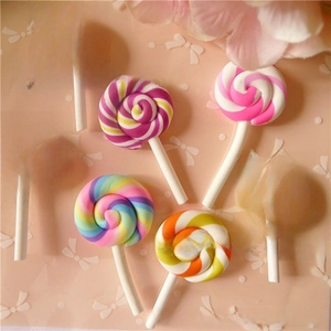 Detail view of colorful spiral swirl marshmallow lollipops for DIY craft accessories