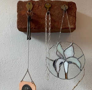 Industrial retro wall hook with red brick base and three vintage bronze key-shaped hangers