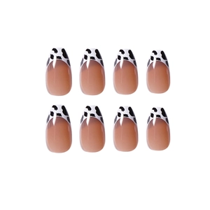 French tip almond fake nails with purple grey base and black white cow print edges