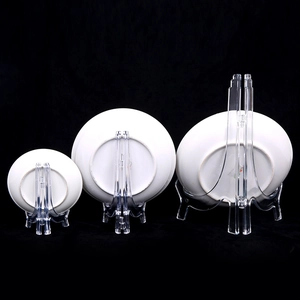 Three clear plastic display stands for plates and photos on a sleek black background
