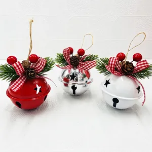 Three metal Christmas bells in red, white and silver with pine needles and bows