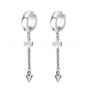 Close-up of silver punk style hoop earrings with cross chains and cone pendants