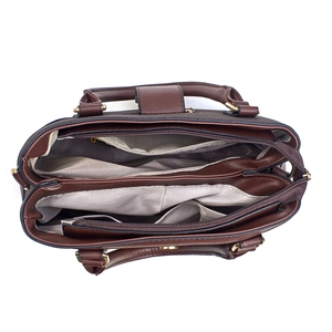 Detail view of large tote bag interior with multiple compartments and herringbone lining