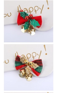 Detailed view of red velvet and plaid Christmas bows with gold bells and holly leaves
