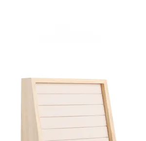 Close-up of wood jewelry tray with fabric slots for ring and earring display