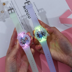 Detail of luminous cartoon watches for children in mint green and light purple shades