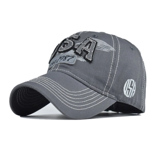 Close-up of vintage washed cotton baseball cap with USA embroidery and detailed stitching