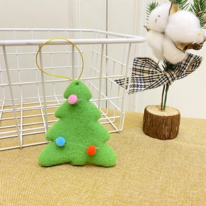 Green felt Christmas tree ornament with colorful pom-poms and golden hanging string detail