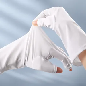 Detail shot showing the high elasticity of the white UV nail protection fingerless gloves