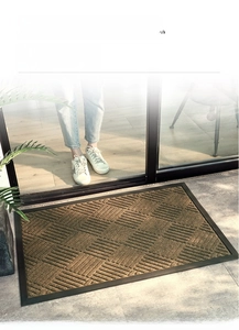 Detail of tan polypropylene door mat with high-low loop pile and anti-slip PVC edging