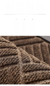 Detailed view of brown fiber doormat with 3D texture for dust removal and scraping
