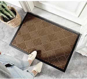 Brown geometric woven door mat with rubber border and non-slip fiber texture