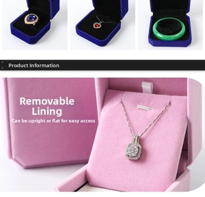 Macro shot of velvet jewelry boxes with removable inserts for rings and necklaces