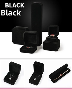 Set of black velvet jewelry boxes including long necklace box and small ring cases
