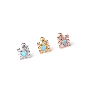 Three snowflake stud earrings with blue opal and cubic zirconia in silver, gold, and rose gold