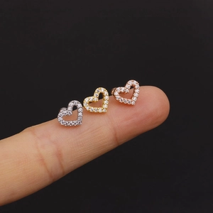 Three heart-shaped stud earrings in silver, gold, and rose gold with sparkling zircon