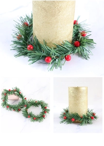 Detail of artificial Christmas candle ring with red berries and green pine needles