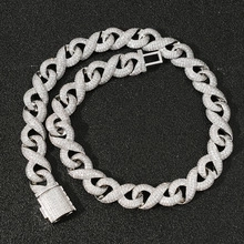 Detail of silver infinity link chain with iced out diamonds and a secure square clasp